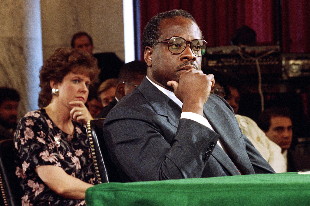 FILE - Supreme Court Justice Nominee Clarence Thomas and his wife Virginia listen during his nomination hearing before the Senate Judiciary Committee on Capitol Hill in Washington, Sept. 10, 1991. (AP Photo/Doug Mills, File)