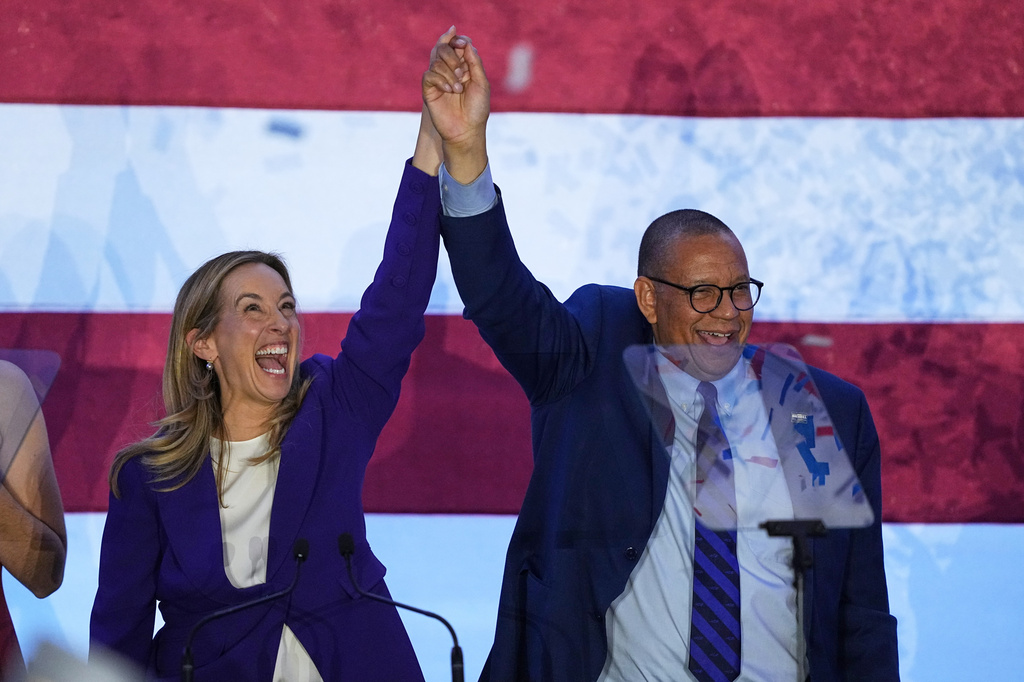 FILE - New Jersey Democratic Gov. elect Mikie Sherrill and Lt. Gov. elect Dale Caldwell celebrate during an election night party in East Brunswick, N.J., Tuesday, Nov. 4, 2025. (AP Photo/Matt Rourke, File)
