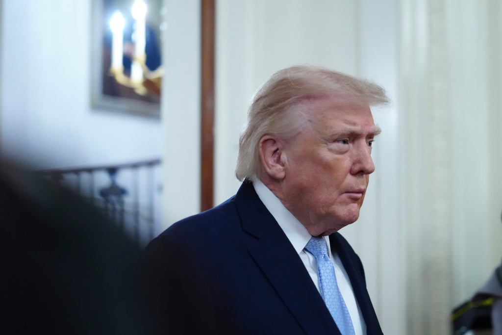 President Donald Trump arriving to speak at the Commander-in-Chief's Trophy presentation with the Navy Midshipmen football team in the East Room of the White House, Friday, March 20, 2026, in Washington. (AP Photo/Julia Demaree Nikhinson)