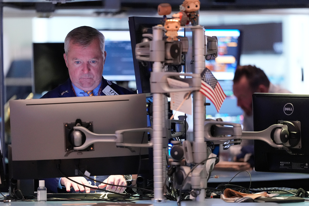 James Lamb works on the floor at the New York Stock Exchange in New York, Thursday, Nov. 13, 2025. (AP Photo/Seth Wenig)