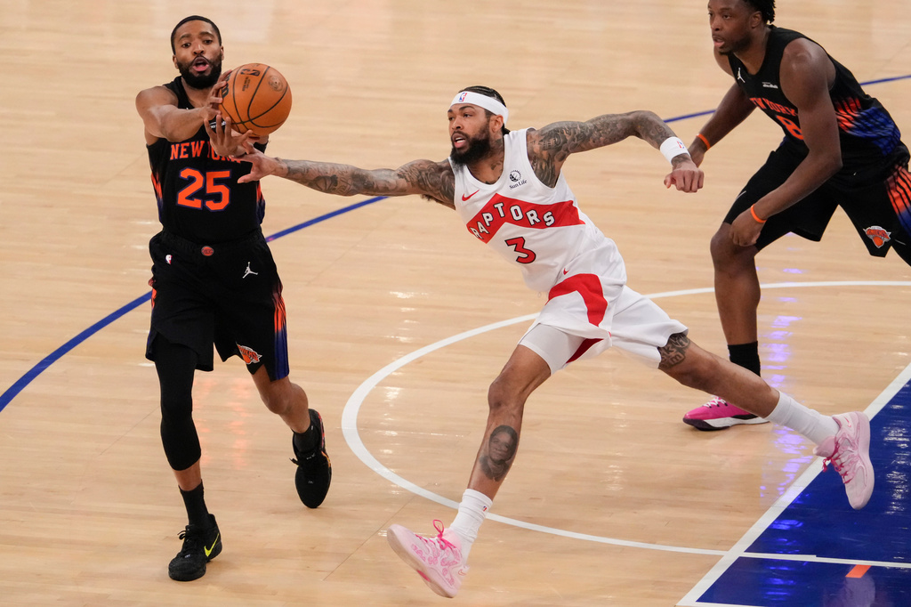 Toronto Raptors forward Brandon Ingram (3) attempts to block New York Knicks guard Mikal Bridges (25) during the first half of an NBA basketball game, Friday, April 10, 2026, in New York. (AP Photo/Yuki Iwamura)
