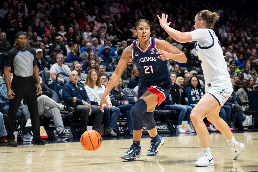UConn forward Sarah Strong (21) drives toward the basket during the second half of an NCAA college basketball game against Xavier, Sunday, Nov. 30, 2025, in Cincinnati. (AP Photo/Tanner Pearson)