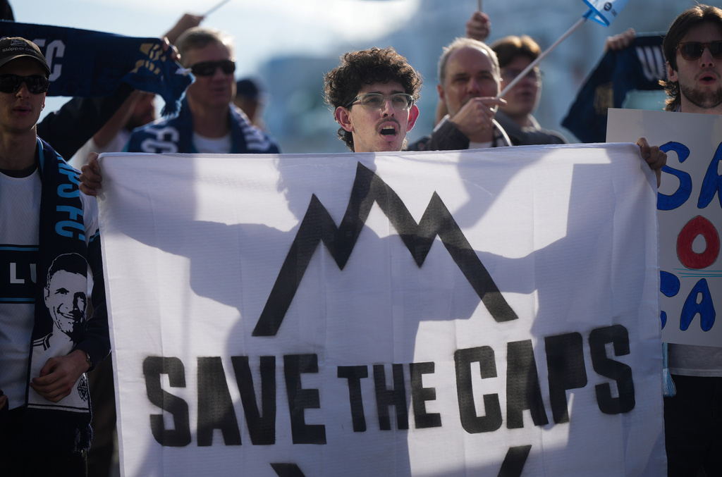 Fans of the Vancouver Whitecaps MLS soccer team rally to keep the team in Vancouver, Thursday, April 30, 2026, outside the 76th FIFA Congress in Vancouver, British Columbia. (Darryl Dyck/The Canadian Press via AP)