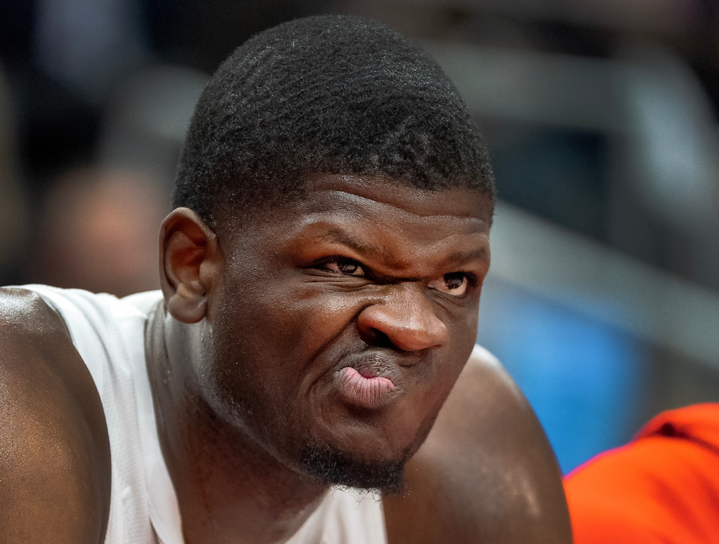 Toronto Raptors centre Mo Bamba makes a face as he watches from the bench during first half NBA action against the Orlando Magic in Toronto on Monday December 29, 2025. (Frank Gunn/The Canadian Press via AP)