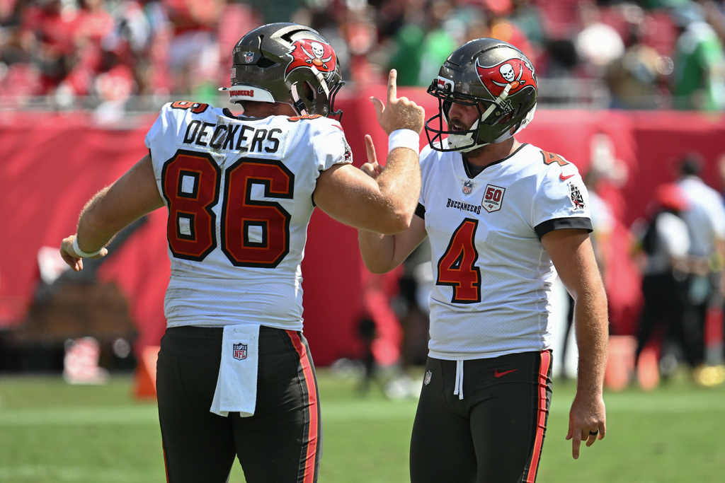 Tampa Bay Buccaneers kicker Chase McLaughlin (4) celebrates with long snapper Evan Deckers (86) after kicking a field goal during the first half of an NFL football game against the Philadelphia Eagles, Sunday, Sept. 28, 2025, in Tampa, Fla. (AP Photo/Jason Behnken)
