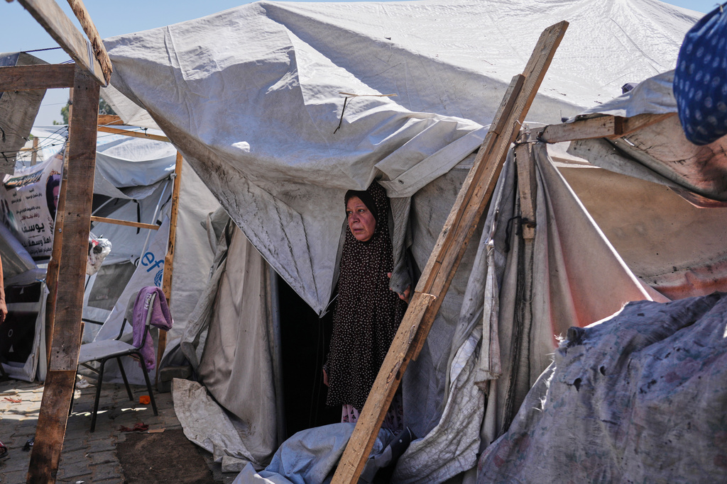 Palestinians inspect a destroyed tent following an Israeli army airstrike in Gaza City, Monday, Sept. 14, 2026. (AP Photo/Jehad Alshrafi)