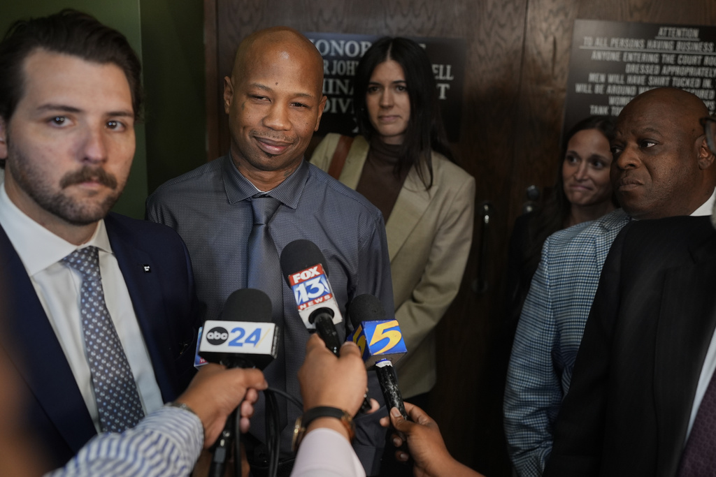 Hernandez Govan, second from left, who was accused of orchestrating the killing of rapper Young Dolph, speaks during a news conference after being acquitted on all charges in his trial, Thursday, Aug. 21, 2025, in Memphis, Tenn. (AP Photo/George Walker IV)