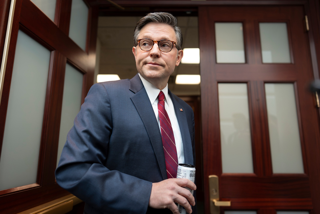 Speaker of the House Mike Johnson, R-La., pauses for questions from reporters as he arrives for an early closed-door Republican Conference meeting on how to end the partial government shutdown and deal with demands over immigration enforcement operations, at the Capitol in Washington, Tuesday, Feb. 3, 2026. (AP Photo/J. Scott Applewhite)