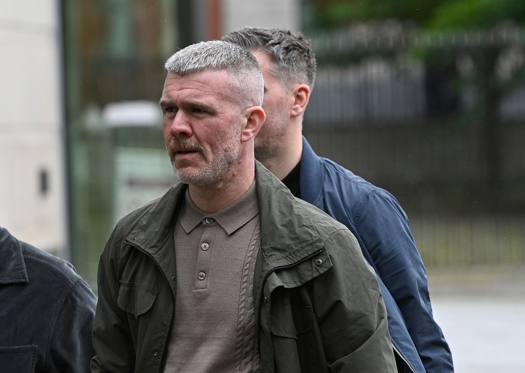 Peter Cavanagh leaves Belfast Crown Court after a non-jury trial of the murder of journalist Lyra McKee, Friday July 3, 2026. (PA via AP)