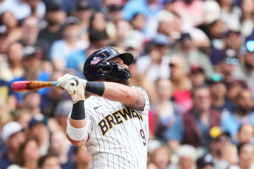 Milwaukee Brewers' Jake Bauers hits a two-run home run during the third inning of a baseball game against the Atlanta Braves, Saturday, Aug. 22, 2026, in Milwaukee. (AP Photo/Aaron Gash)