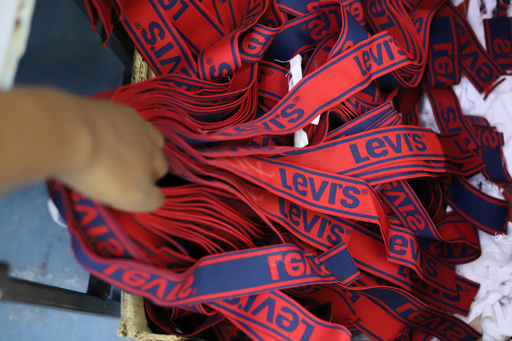 FILE - A label reading "Levis" on a pair of Levi Strauss & Co jeans is displayed at a production line at United Aryan EPZ Limited in Ruaraka on the outskirts of Nairobi, Kenya, March 21, 2025. (AP Photo/Andrew Kasuku, File) FILE - A label reading "Levis" on a pair of Levi Strauss & Co jeans is displayed at a production line at United Aryan EPZ Limited in Ruaraka on the outskirts of Nairobi, Kenya, March 21, 2025. (AP Photo/Andrew Kasuku, File)
