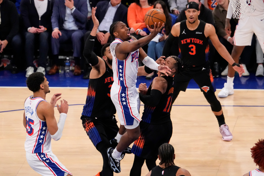 Philadelphia 76ers guard Tyrese Maxey (0) shoots over New York Knicks guard Jalen Brunson (11) during the second half of Game 2 in a second-round NBA basketball playoffs series, Wednesday, May 6, 2026, in New York. (AP Photo/Yuki Iwamura)