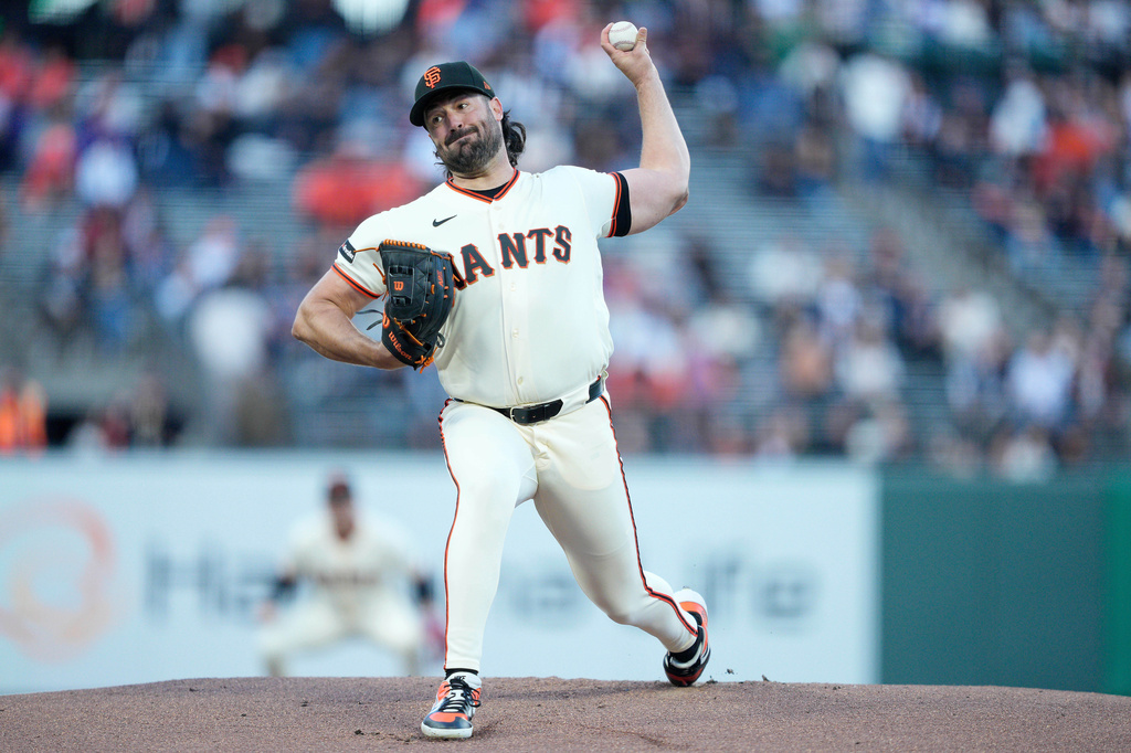 San Francisco Giants pitcher Robbie Ray throws against the New York Mets during the first inning of a baseball game in San Francisco, Thursday, April 2, 2026. (AP Photo/Tony Avelar)