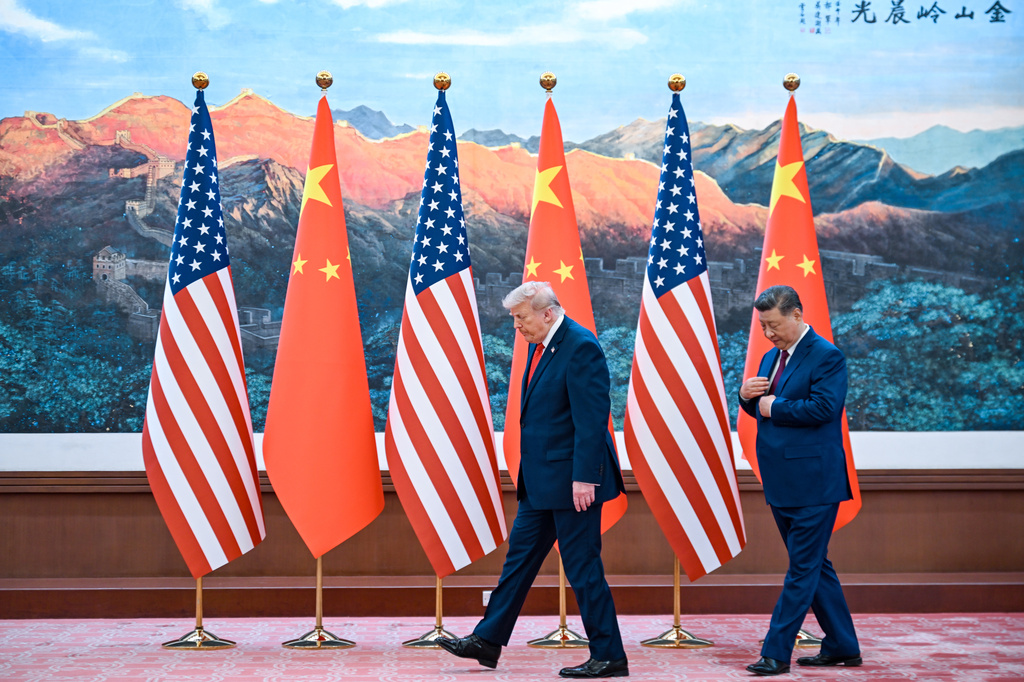 Chinese President Xi Jinping, right, and U.S. President Donald Trump meet at the Great Hall of the People in Beijing, Thursday, May 14, 2026. (Kenny Holston/Pool Photo via AP)