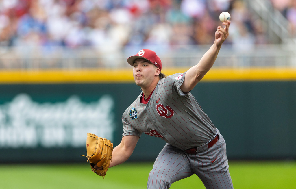 Oklahoma's Cord Rager throws against North Carolina during the first inning in Game 1 of the NCAA College World Series baseball finals in Omaha, Neb., Saturday, June 20, 2026. (AP Photo/Rebecca S. Gratz)