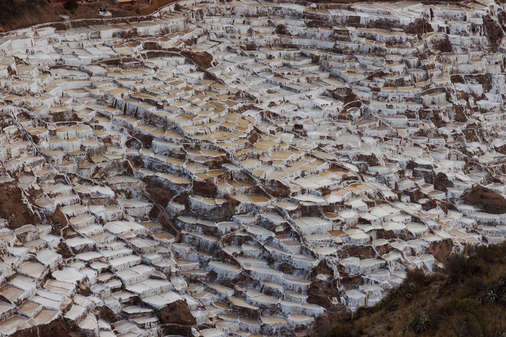 Salineras de Maras, the Maras salt mines, are mined by families who have owned the ponds for generations in the Sacred Valley, near Cusco, Peru on Saturday, Aug. 30, 2025. (AP Photo/Alie Skowronski)