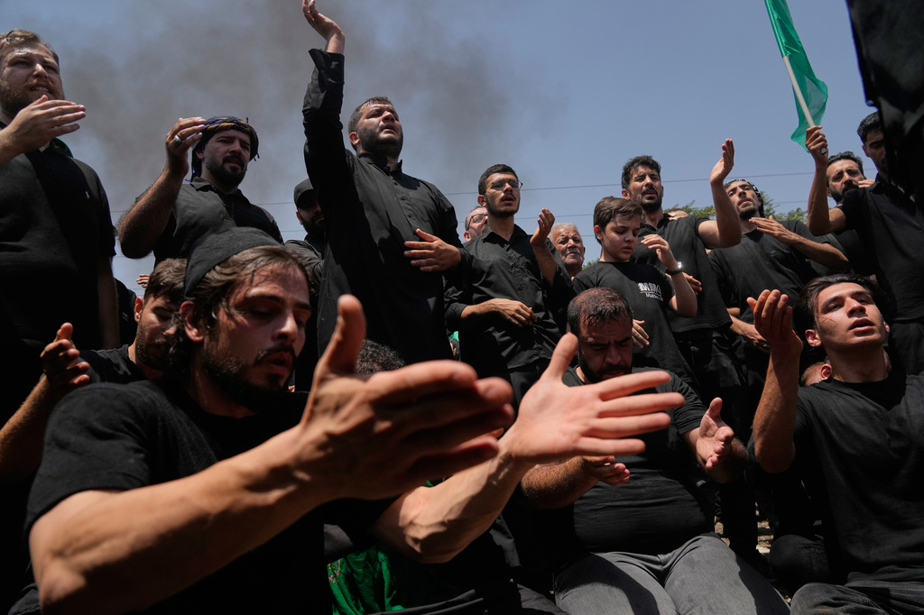 Mourners beat their heads and chests in a ceremony in Tehran, Iran, Thursday, June 25, 2026, in the holy day of Ashoura which commemorates the martyrdom of Imam Hussein, a grandson of the Prophet Muhammad, one of Shiite Islam's most beloved saints, and his family and companions at the Battle of Karbala in A.D. 680, in present-day Iraq, after refusing to pledge allegiance to the Umayyad caliphate. (AP Photo/Vahid Salemi)