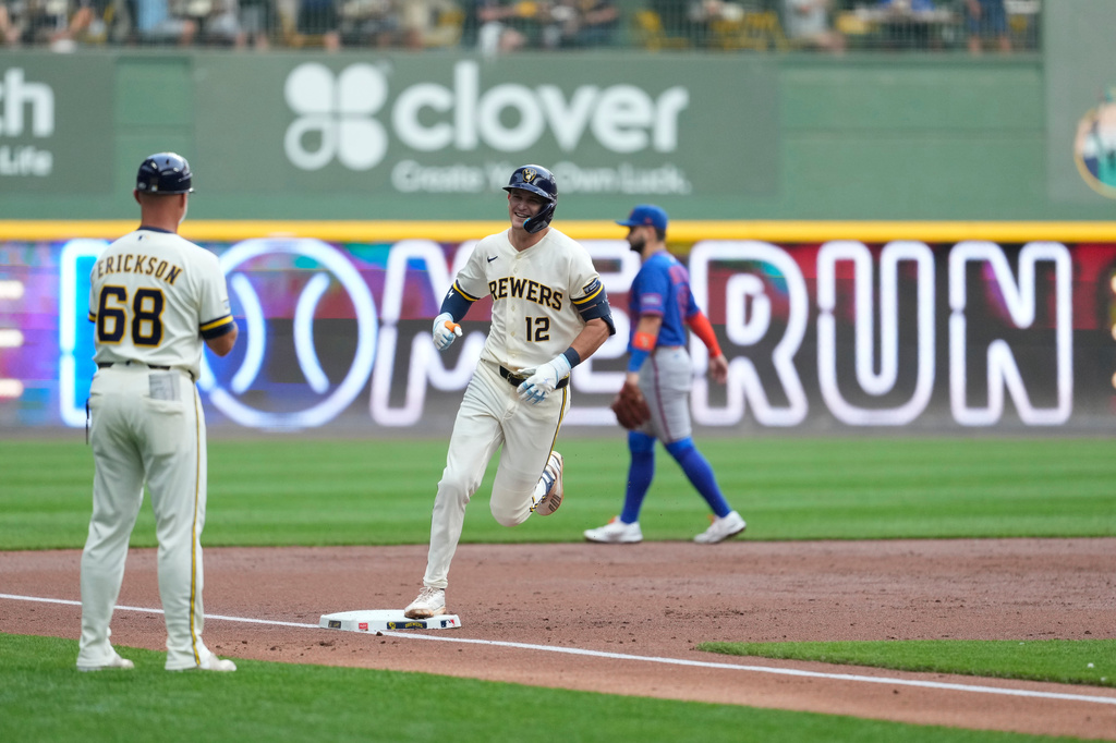 Milwaukee Brewers' Cooper Pratt (12) smiles as he rounds the bases after hitting a solo home run during the second inning of a baseball game against the New York Mets, Monday, July 20, 2026, in Milwaukee. (AP Photo/Aaron Gash)