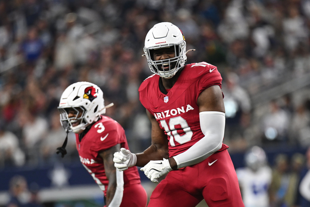 Arizona Cardinals linebacker Josh Sweat (10) celebrates after sacking Dallas Cowboys' Dak Prescott in the first half of an NFL football game Monday, Nov. 3, 2025, in Arlington, Texas. (AP Photo/Jessica Tobias)