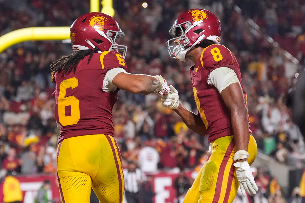 Southern California wide receiver Makai Lemon, left, celebrates his touchdown with wide receiver Ja'Kobi Lane during the second half of an NCAA college football game against Northwestern, Friday, Nov. 7, 2025, in Los Angeles. (AP Photo/Mark J. Terrill)
