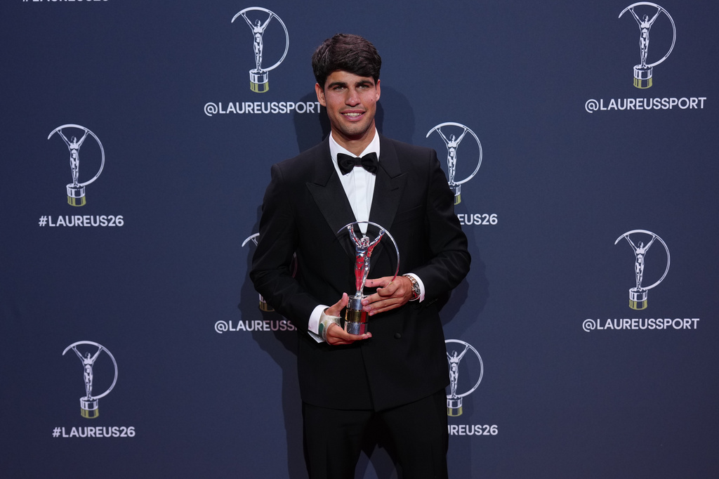 Carlos Alcaraz poses with his Laureus World Sportsman of the Year award during the 2026 Laureus World Sports Awards ceremony in Madrid, Spain, Monday, April 20, 2026. (AP Photo/Manu Fernandez)