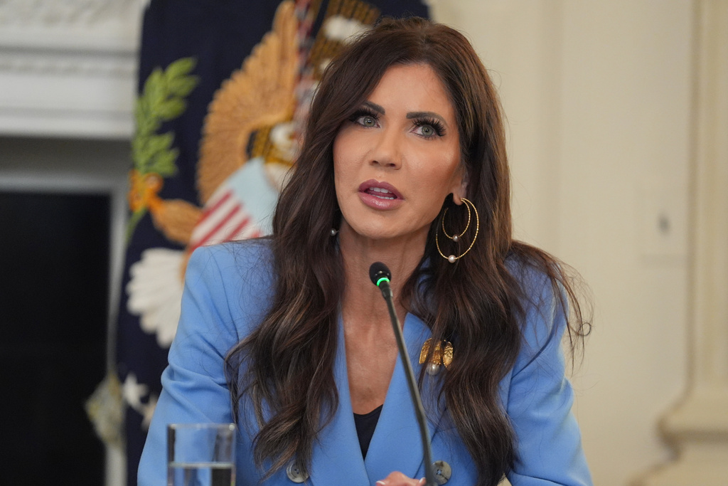 Homeland Security Secretary Kristi Noem speaks during a roundtable meeting with President Donald Trump on antifa in the State Dining Room at the White House, Wednesday, Oct. 8, 2025, in Washington. (AP Photo/Evan Vucci)