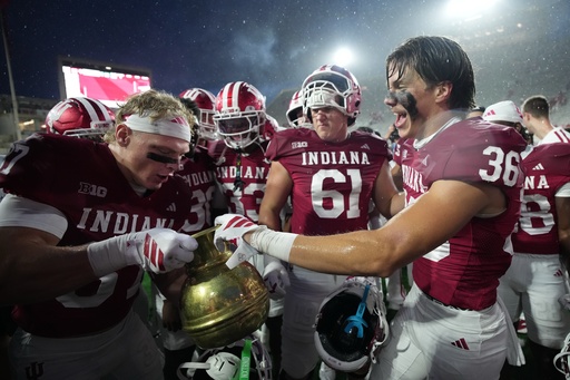 Indiana players celebrate with the Old Brass Spittoon following an NCAA college football game against the Michigan State, Saturday, Oct. 18, 2025, in Bloomington, Ind. (AP Photo/AJ Mast) Indiana players celebrate with the Old Brass Spittoon following an NCAA college football game against the Michigan State, Saturday, Oct. 18, 2025, in Bloomington, Ind. (AP Photo/AJ Mast)