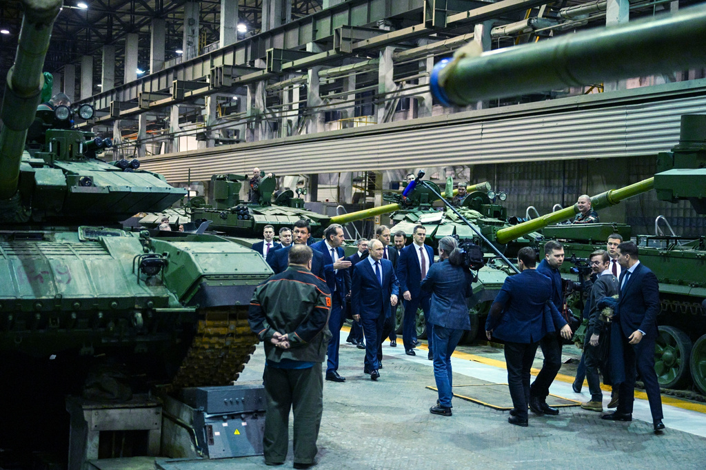FILE - Russian President Vladimir Putin, center, visits the Uralvagonzavod factory in Nizhny Tagil, Russia, on Thursday, Feb. 15, 2024. (Ramil Sitdikov, Sputnik, Kremlin Pool Photo via AP, File)