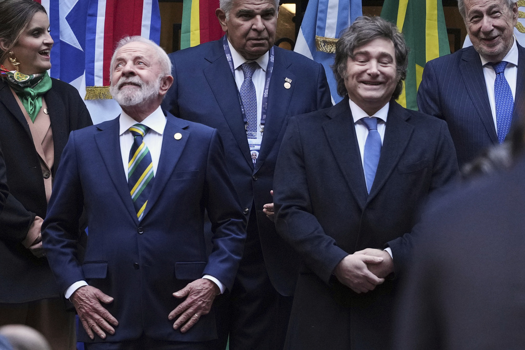 FILE - Brazil's President Luiz Inacio Lula da Silva, front left, and Argentina's President Javier Milei, stand next to each other as they get into position for a group photo with other leaders attending the Mercosur Summit in Buenos Aires, Argentina, July 3, 2025. (AP Photo/Natacha Pisarenko, File)