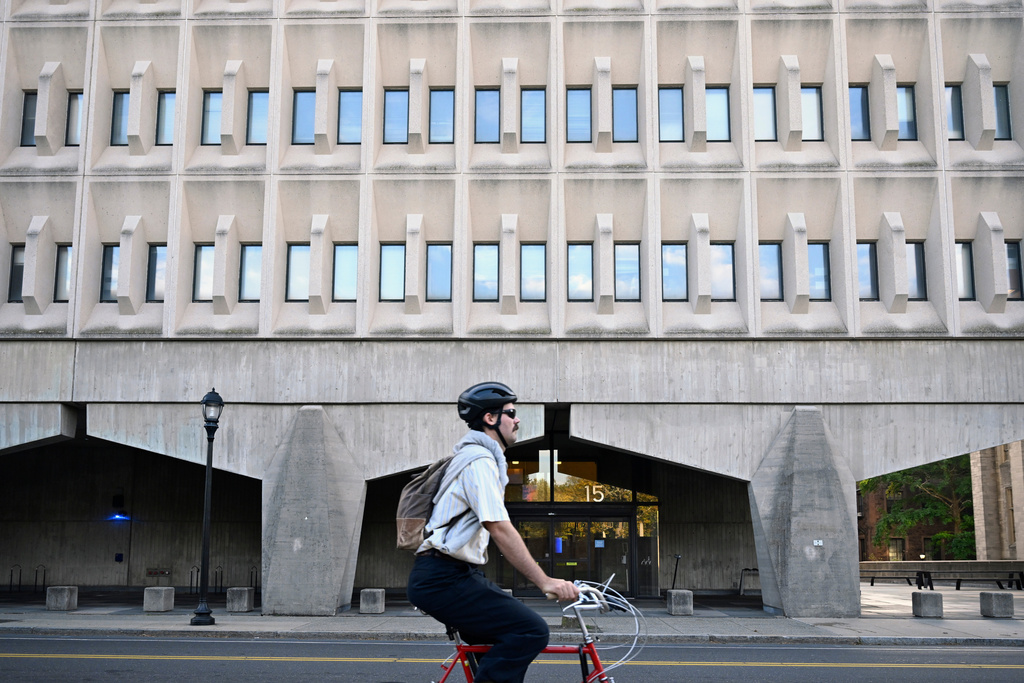 A bicyclist rides past the Becton Engineering and Applied Science Center at Yale University where Yale Professor Emeritus of Applied Physics Michel Devoret has an office and laboratory, Tuesday, Oct. 7, 2025, in New Haven, Conn. (AP Photo/Jessica Hill)