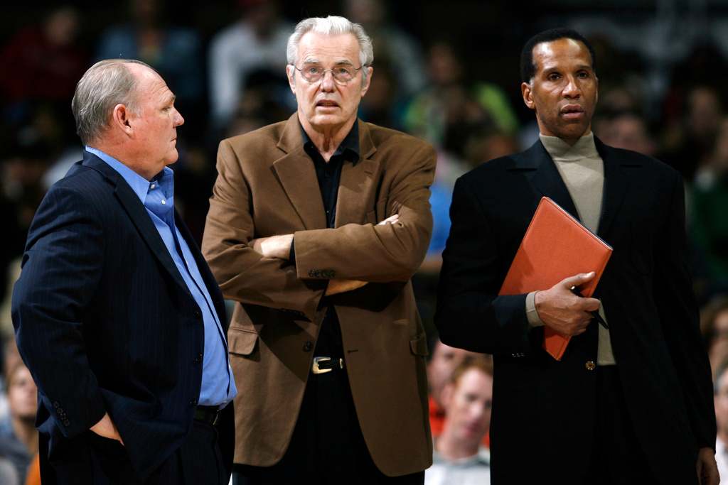 FILE - Denver Nuggets head coach George Karl, left, chats with assistant coaches Doug Moe, center, and Adrian Dantley during a time out against the Los Angeles Clippers in the first quarter of an exhibition NBA basketball game in Denver on Oct. 9, 2007. (AP Photo/David Zalubowski, File)