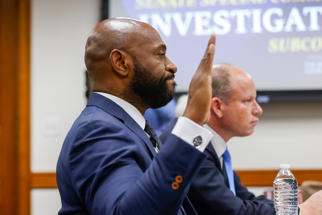 Former Fulton County special prosecutor Nathan Wade is sworn in for his testimony at a Senate Special Committee on Investigations Subcommittee hearing at the Capitol in Atlanta, Friday, March 13, 2026. (Arvin Temkar/Atlanta Journal-Constitution via AP)