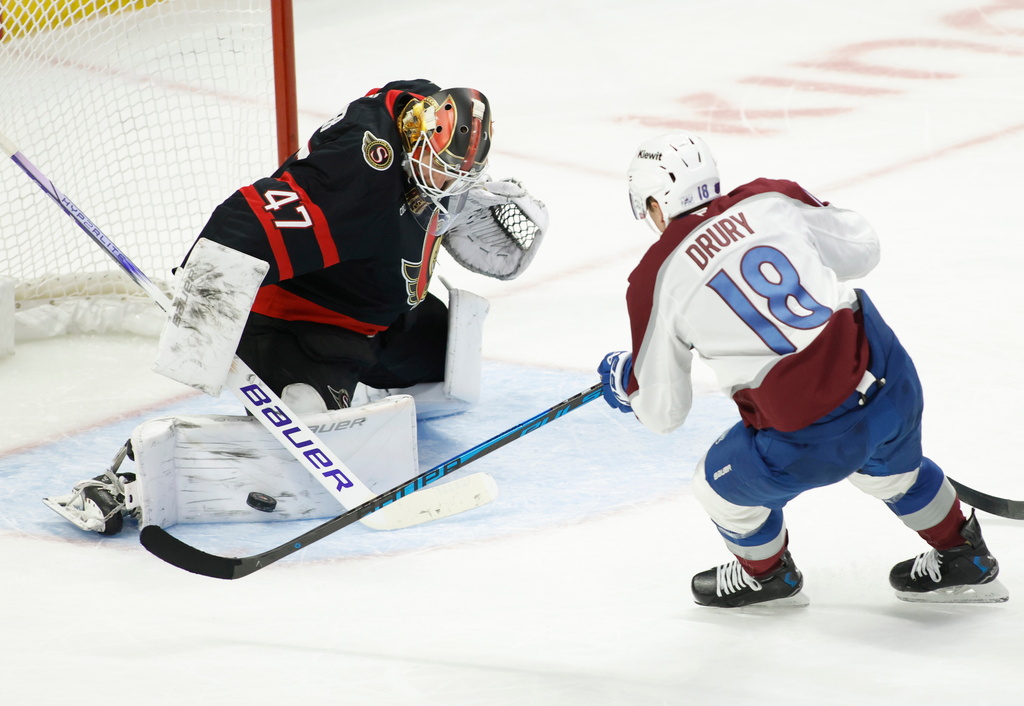 Ottawa Senators' goaltender James Reimer (47) makes a save on Colorado Avalanche's Jack Drury (18) during the second period of an NHL hockey game in Ottawa, Ontario, on Wednesday, Jan. 28, 2026. (Patrick Doyle/The Canadian Press via AP)