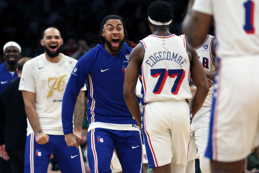Philadelphia 76ers' players greet teammate VJ Edgecombe (77) after he hit a third quarter three point shot during Game 7 in a first-round NBA basketball playoffs series, Saturday, May 2, 2026 in Boston. (AP Photo/Jim Davis)