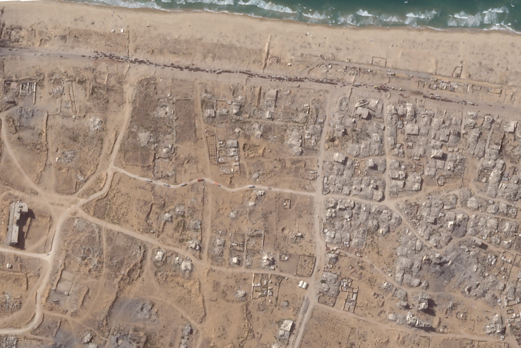 In this satellite photo from Planet Labs PBC, a line of vehicles can be seen waiting to travel north along the Al Rashid Street to Gaza City, Gaza Strip, Saturday, Oct. 11, 2025. (Planet Labs PBC via AP)