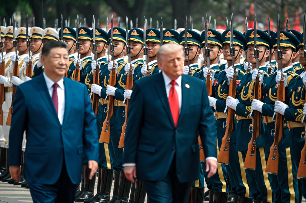 President Donald Trump reviews troops at the Great Hall of the People, Thursday, May 14, 2026, in Beijing. (Kenny Holston/The New York Times via AP, Pool)