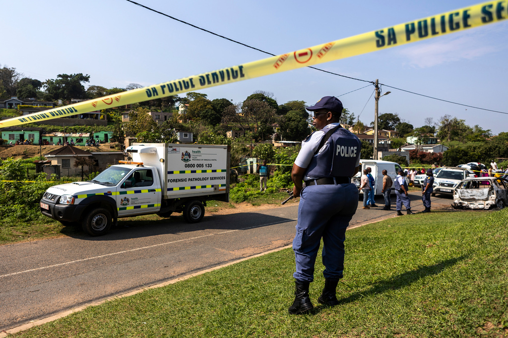 A police officer is seen at a scene of a mass shooting at a house party in KwaMakhutha township south of the city Durban, South Africa, Wednesday, Sept. 23, 2026. (AP Photo)