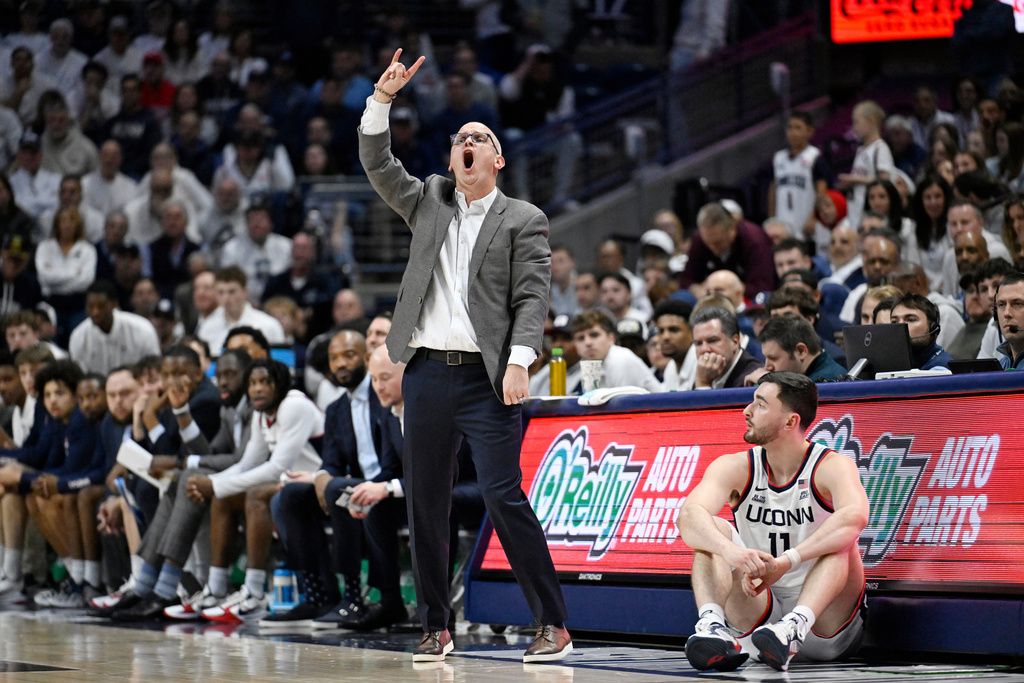 UConn head coach Dan Hurley gestures as UConn forward Alex Karaban looks on in the first half of an NCAA college basketball game against Arizona, Wednesday, Nov. 19, 2025, in Storrs, Conn. (AP Photo/Jessica Hill)