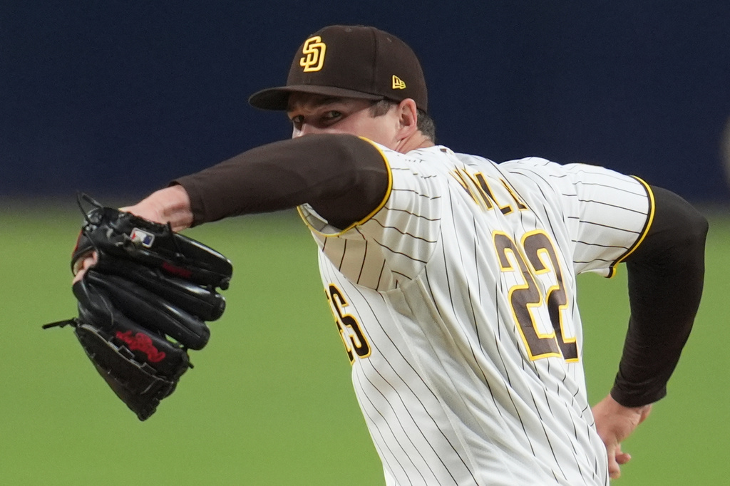 San Diego Padres pitcher Mason Miller works against a Seattle Mariners batter during the ninth inning of a baseball game Tuesday, April 14, 2026, in San Diego. (AP Photo/Gregory Bull)