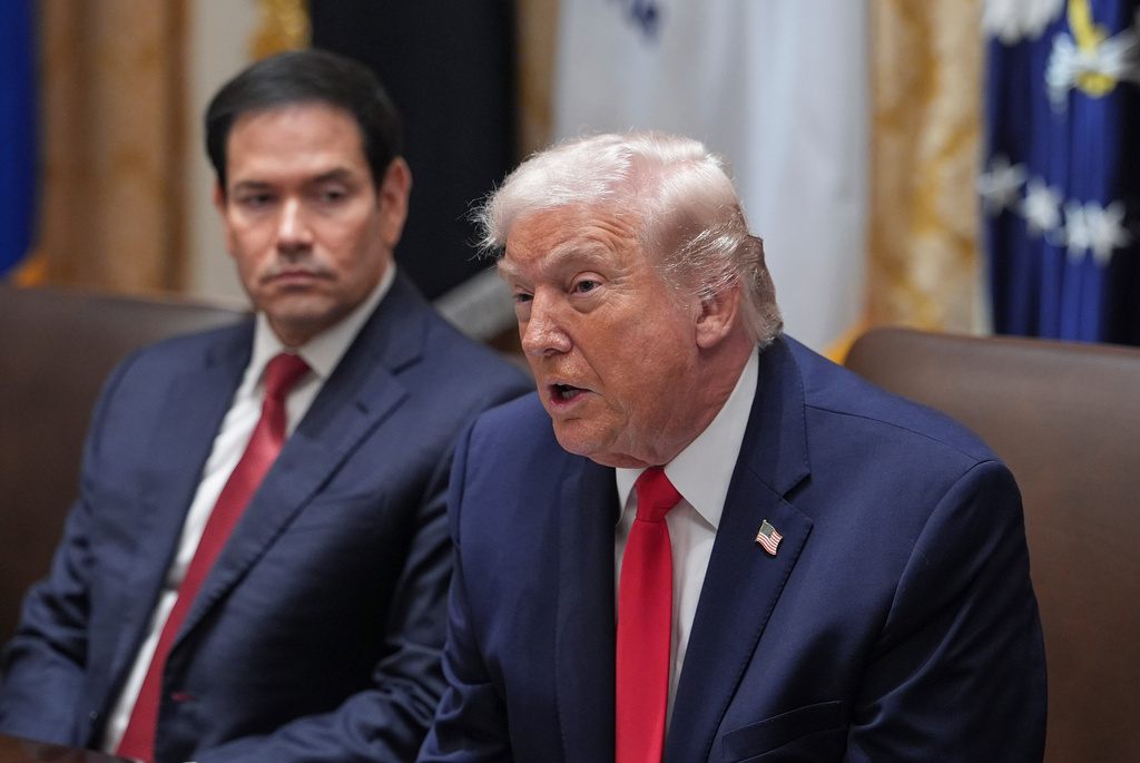 President Donald Trump speaks as Secretary of State Marco Rubio listens during a cabinet meeting at the White House, Thursday, Jan. 29, 2026, in Washington. (AP Photo/Evan Vucci)