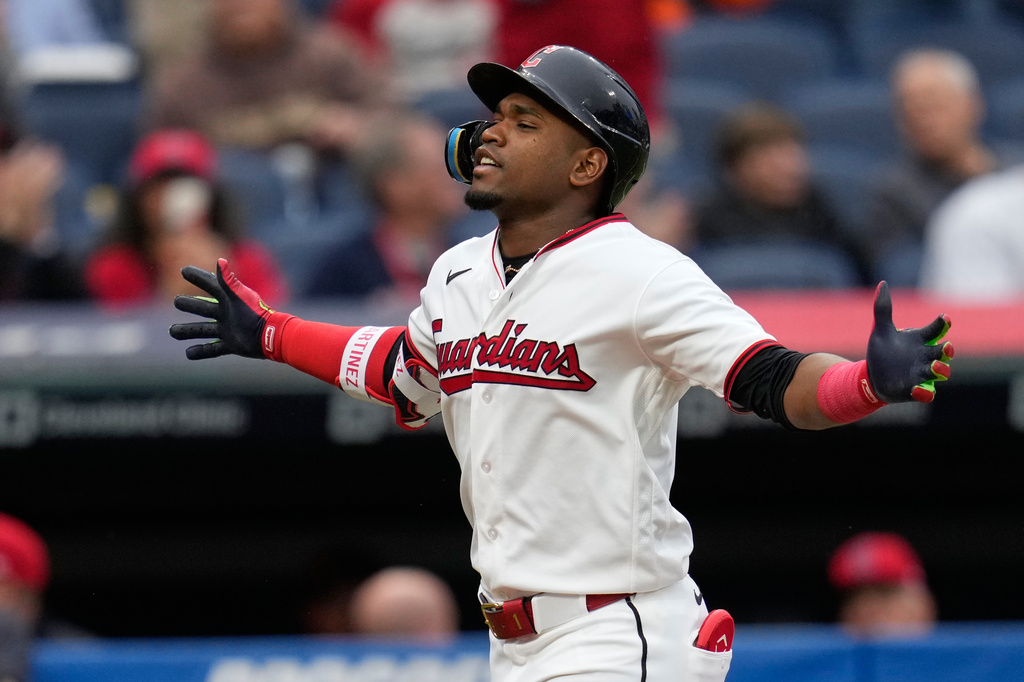 Cleveland Guardians 'Angel Martínez gestures as he runs toward home plate with a solo home run in the third inning of a baseball game against the Los Angeles Angels in Cleveland, Tuesday, May 12, 2026. (AP Photo/Sue Ogrocki)
