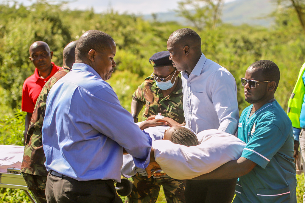 A victim of a fire is carried from a Kenyan Air Force aircraft at St. Joseph Hospital after a fire at Utumishi Girls School in the Gilgil area, central Kenya, Thursday, May 28, 2026. (AP Photo/Patrick Ngugi)