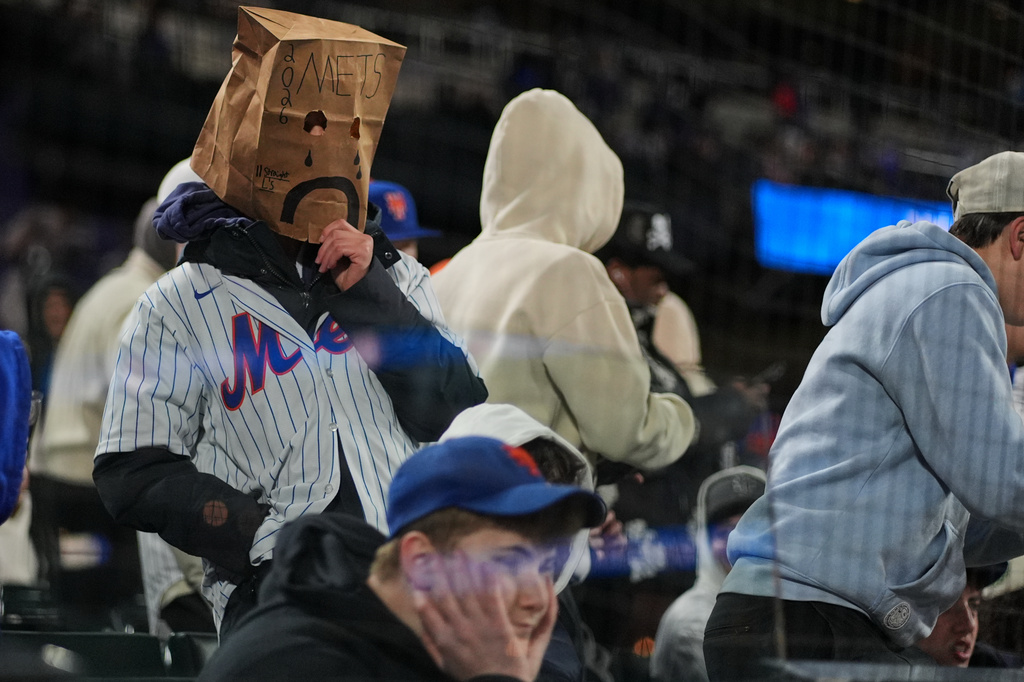 Mets fans watch during the eighth inning of a baseball game between the New York Mets and the Minnesota Twins Tuesday, April 21, 2026, in New York. (AP Photo/Frank Franklin II)