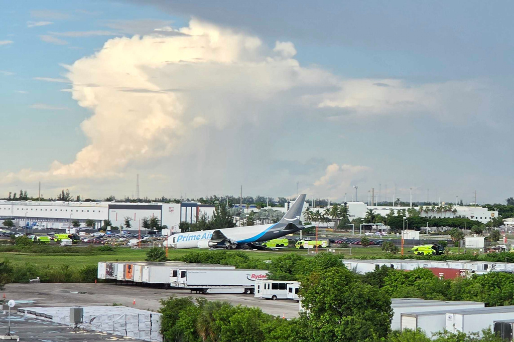 An Amazon cargo plane sits at the Miami International Airport (MIA) after it overshot the runway, Sunday, Sept. 6, 2026. (AP Photo/David Fischer)