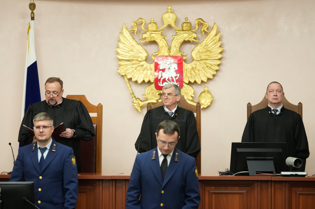 Chairman of the Appellate Board of the Supreme Court judge Vladimir Zaitsev, background center, his deputy Igor Zinchenko, and Judge Denis Tyutin, attend a reading of the court decision on an appeal against its ruling to bar the Yabloko party from the upcoming parliamentary elections, at the Russia's Supreme Court, in Moscow, Monday, Aug. 17, 2026. (AP Photo/Pavel Bednyakov)