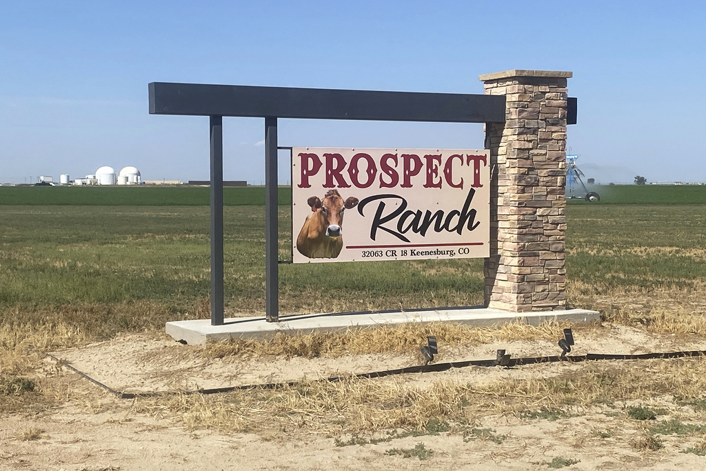 A sign stands at Prospect Ranch outside of Prospect Valley Dairy east of Keenesburg, Colo., on Thursday, Aug. 21, 2025. (Chris Bolin/Denver Post via AP)