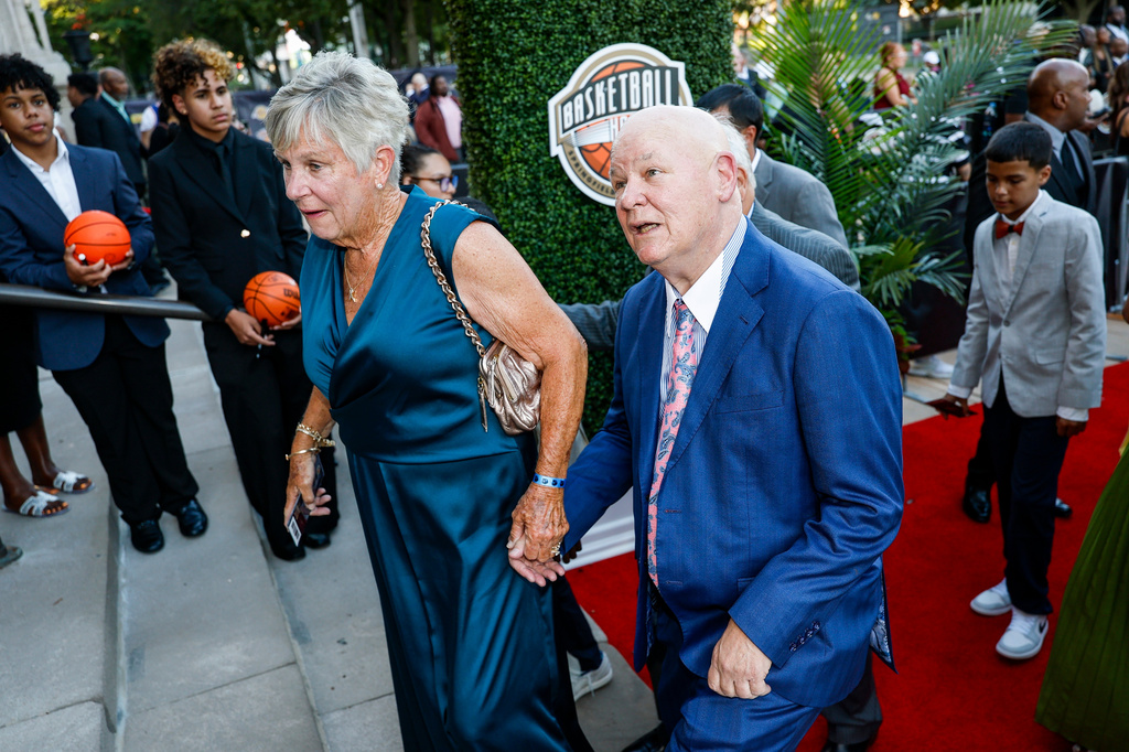 Veteran NBA referee and 2026 inductee Joey Crawford, right, recognizes his image on the columns of Symphony Hall as he enters the 2026 Naismith Basketball Hall of Fame induction ceremony Saturday, Aug. 15, 2026, in Springfield, Mass. (AP Photo/Rusty Jones)
