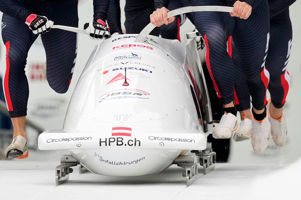 Markus Treichl, Markus Sammer, Sascha Stepan and Kristian Huber, of Austria, compete in the 4-man bobsleigh race at the Bobsleigh World Cup in Innsbruck, Austria, Sunday, Nov. 30, 2025. (AP Photo/Matthias Schrader)