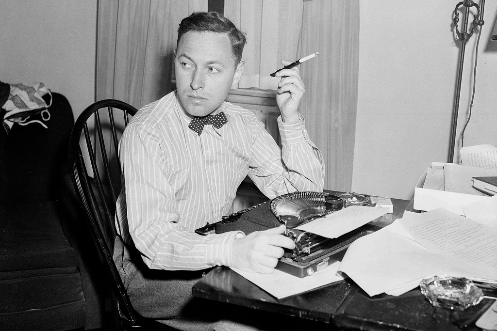 FILE - Playwright Tennessee Williams sits at his typewriter in New York on Nov. 11, 1940. (AP Photo/Dan Grossi, File)