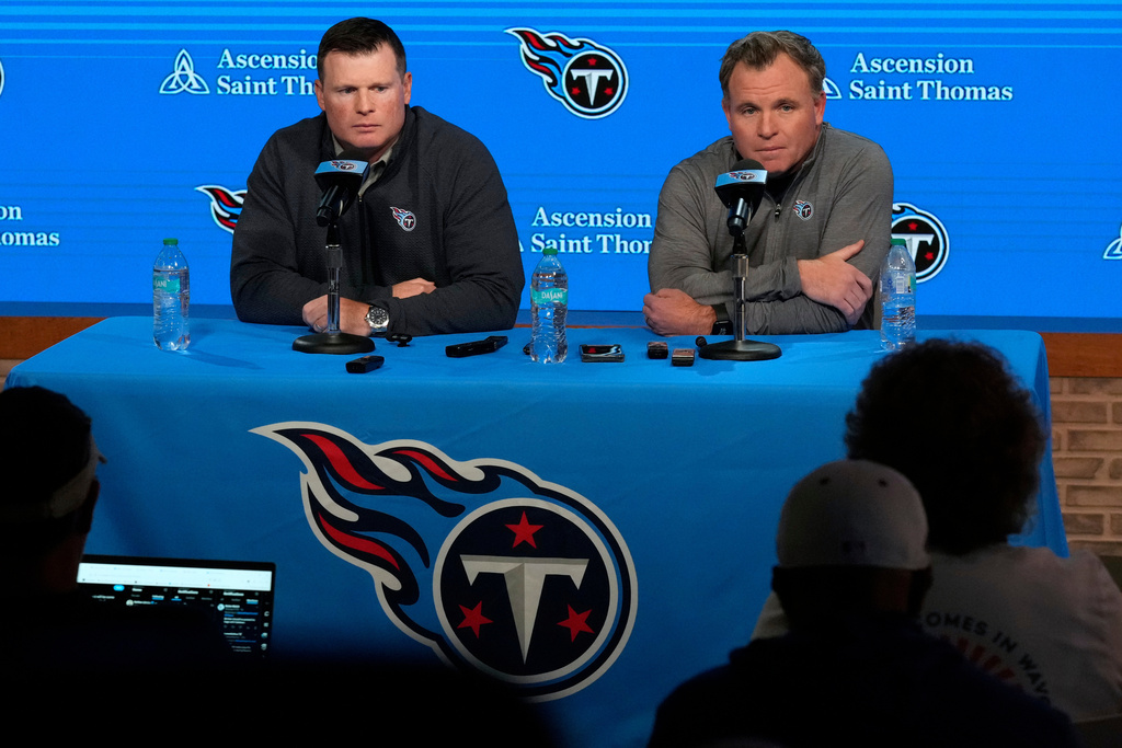 Tennessee Titans president of football operations Chad Brinker, left, and general manager Mike Borgonzi respond to questions during a news conference at the NFL football team's training facility Monday, Oct. 13, 2025, in Nashville, Tenn. (AP Photo/George Walker IV)